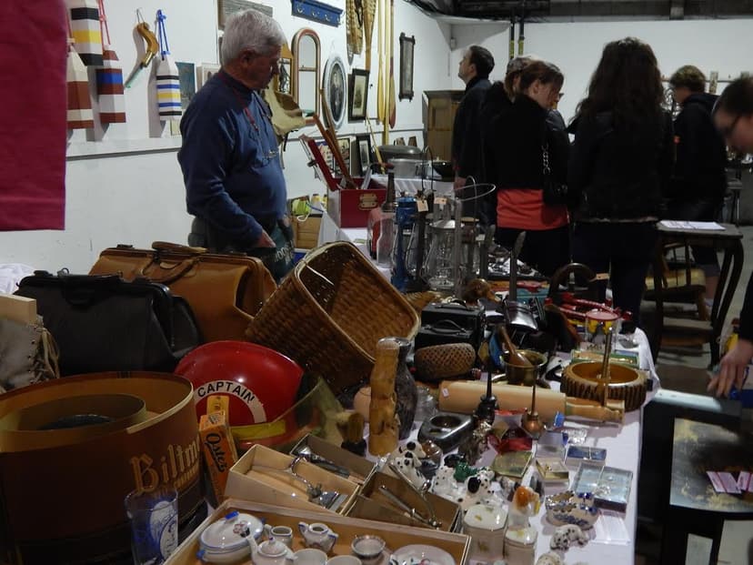 A vendor's table of antiques and collectibles at a past World's Largest Garage Sale event