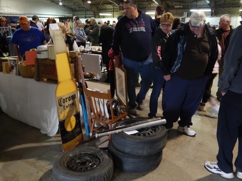A vendor's table of vintage finds and collectibles at a past World's Largest Garage Sale event